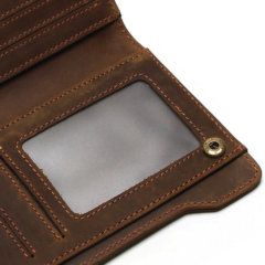 Foto de billetera larga vintage bifold con cierre de cuero natural mostrando su bolsillo para ID en color café